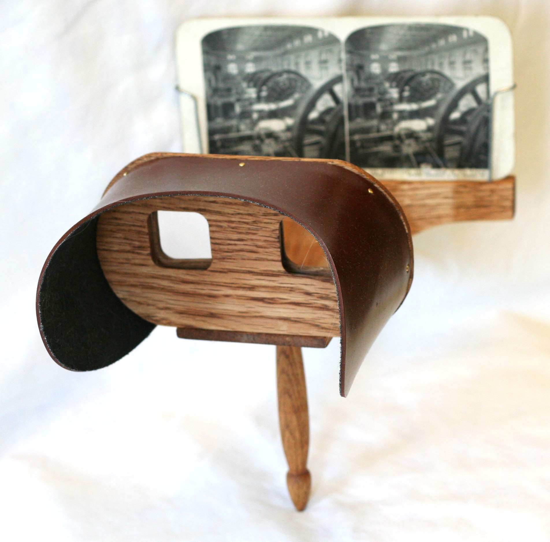 A Holmes stereoscope shown as a side-by-side stereoscopic image.